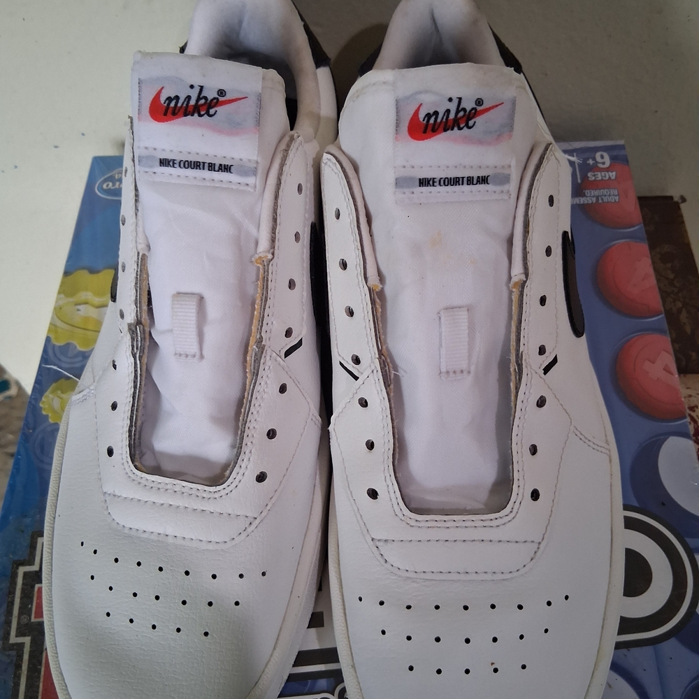 Nike Men’s White Leather Court Sneakers with Red Swoosh Accent